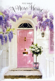 This image portrays a welcoming doorway that feels very much at home in Hornsey, where characterful houses and thoughtful planting often meet. At the centre stands a pink front door, painted in a soft, rose-blush hue that glows quietly rather than shouting for attention. The surrounding wall is whitewashed and subtly uneven, catching the light in a way that gives texture and warmth, while a pale pink shutter nearby echoes the door's tone to create an easy, harmonious backdrop. Above, a cascade of wisteria in gentle lavender shades drapes down over the lintel, forming a loose floral curtain. Each hanging cluster of blossoms is made up of tiny petals that appear almost velvety, and you can almost imagine the delicate, sweet-floral scent drifting into the street, much like the fragrance you might notice when walking past well-kept front gardens off Priory Road in late spring. On the doorstep itself rests a stylish grey metal bucket, set deliberately but without fuss. From it rises a generous arrangement of white and cream roses, their petals full, ruffled, and softly luminous, suggesting they are fresh and recently arranged. Interspersed are sprigs of silvery-green and soft green foliage, adding movement, contrast, and a whisper of garden wildness that keeps the composition from feeling too formal. The bucket is finished with a pink ribbon tied neatly around its base, its satin texture catching light and subtly repeating the blush notes of door and shutter. Gentle sunlight filters across the scene, casting dappled shadows from the wisteria onto the steps and creating a feeling of sheltered calm. Altogether, the doorway and floral display evoke the tender anticipation of moving into a new home in Hornsey - hopeful, welcoming, and quietly joyful, as if every bloom is wishing good fortune at the threshold.